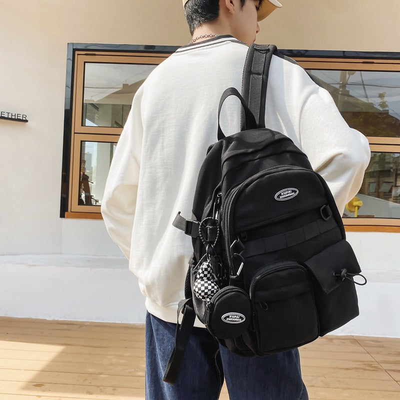 Black nylon student backpack with multiple pockets, laptop compartment, and ergonomic design.