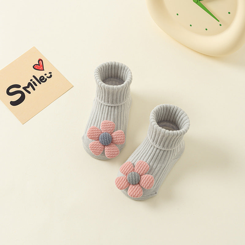 Gray ribbed cotton baby socks with pink and gray flower appliques, featuring anti-slip soles.