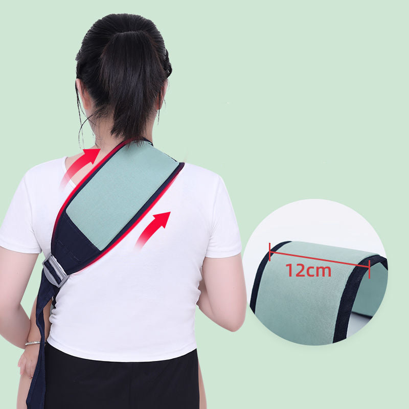 Woman wearing a light green ergonomic baby carrier with a wide 12cm shoulder strap, distributing weight.