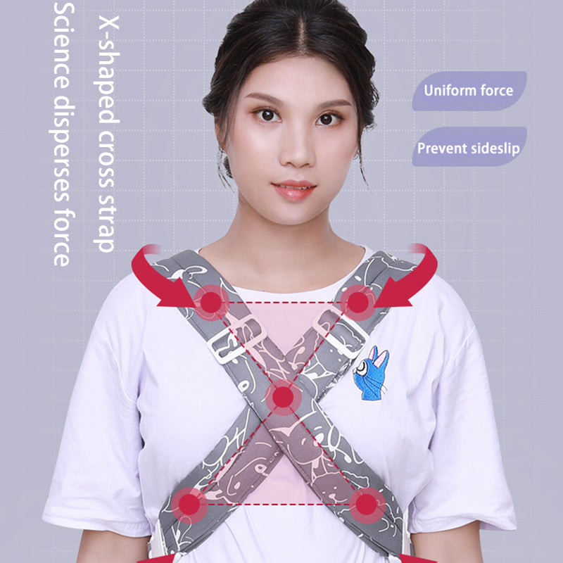 Woman modeling a gray ergonomic baby carrier with X-shaped cross straps for uniform force and anti-sideslip.