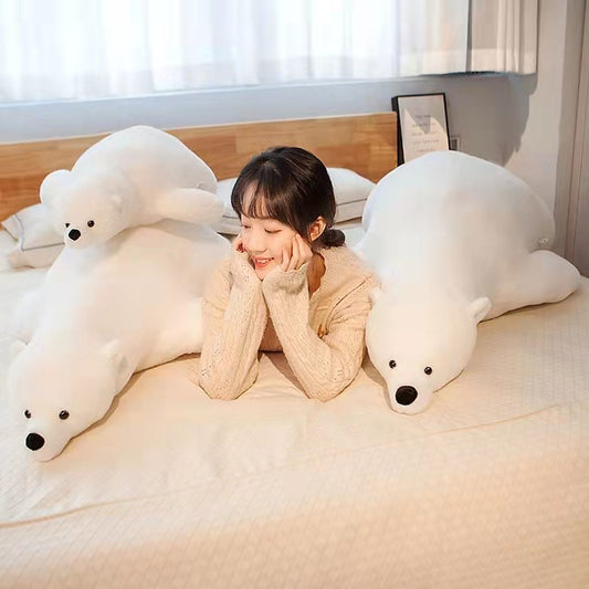 Soft, giant 110cm white plush polar bear stuffed animal with a smaller bear, beside a woman on a bed.