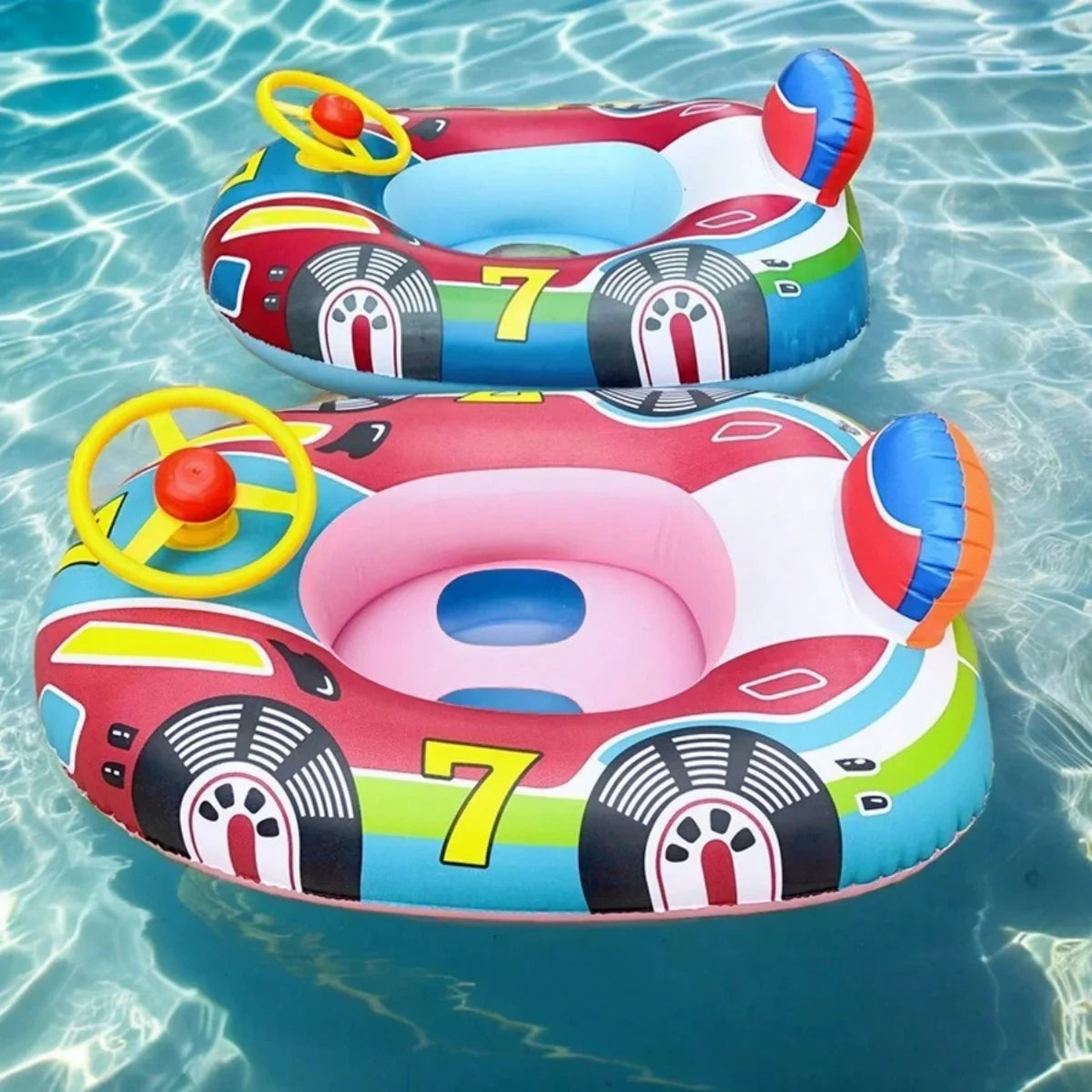 Two colorful inflatable baby car floats with steering wheels and safety seats in a pool.