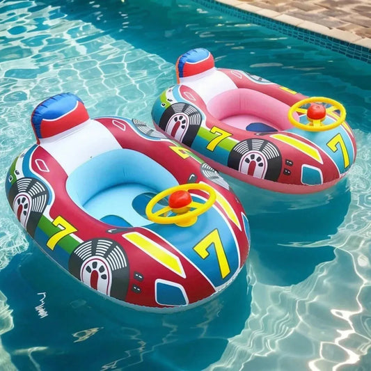 Two colorful inflatable baby pool floats, shaped like race cars with safety seats and steering wheels, floating in a pool.