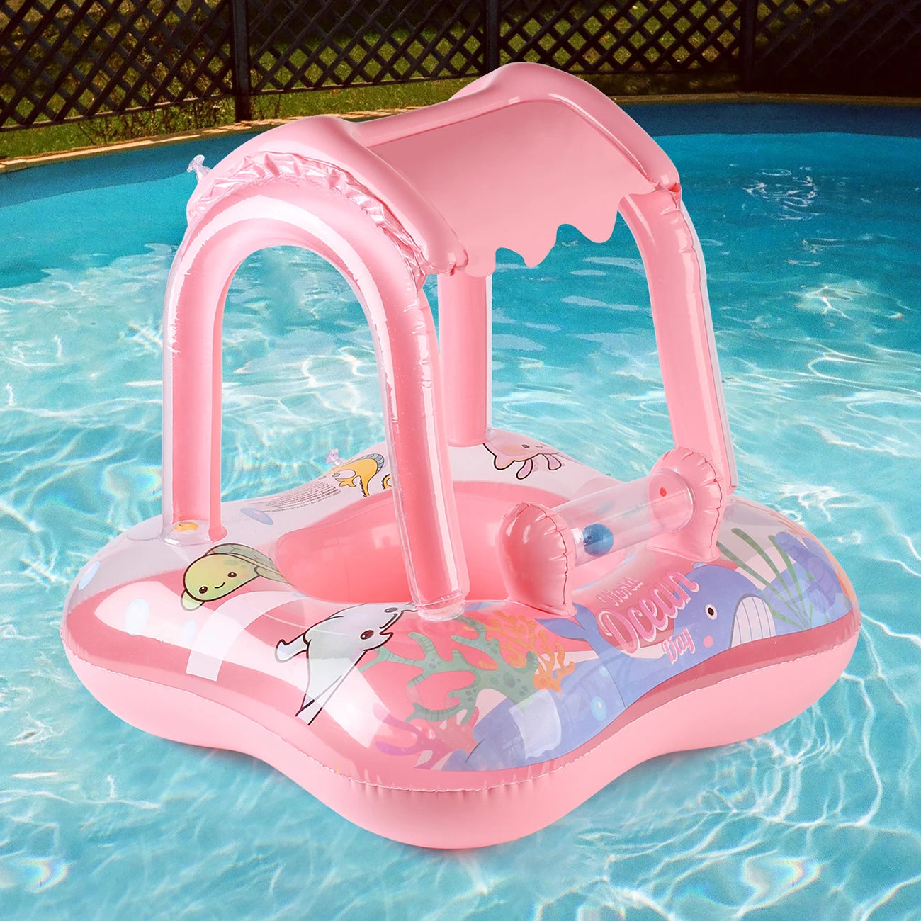 Pink inflatable baby pool float with sun canopy and ocean animal design.
