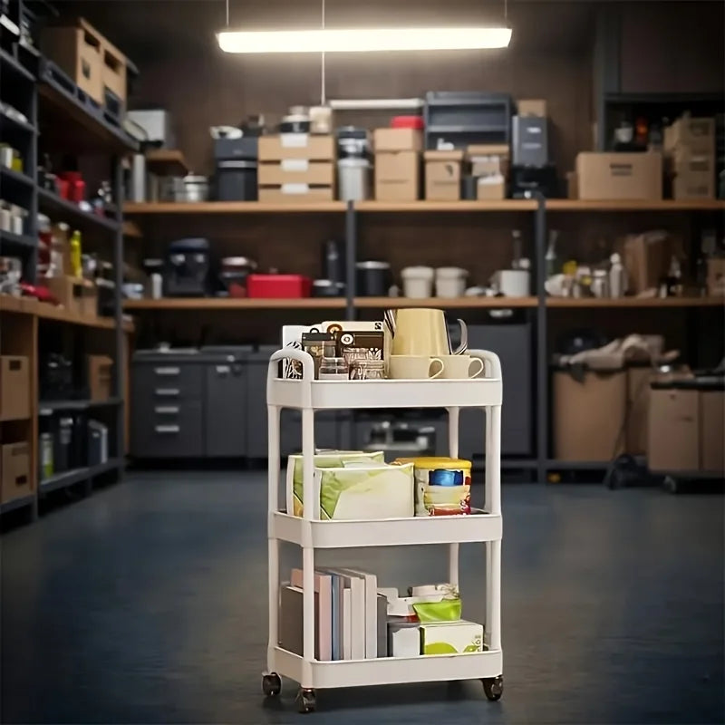 White 3-tier plastic rolling storage cart with items, in a warehouse setting.