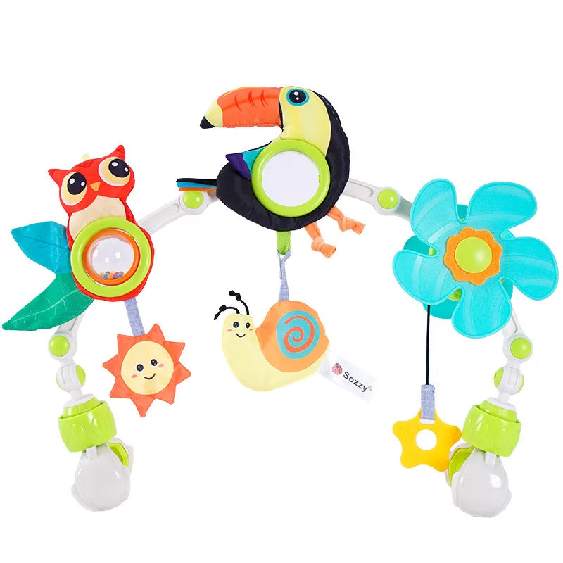 Colorful baby activity arch with hanging owl, toucan, snail, sun, and flower toys.