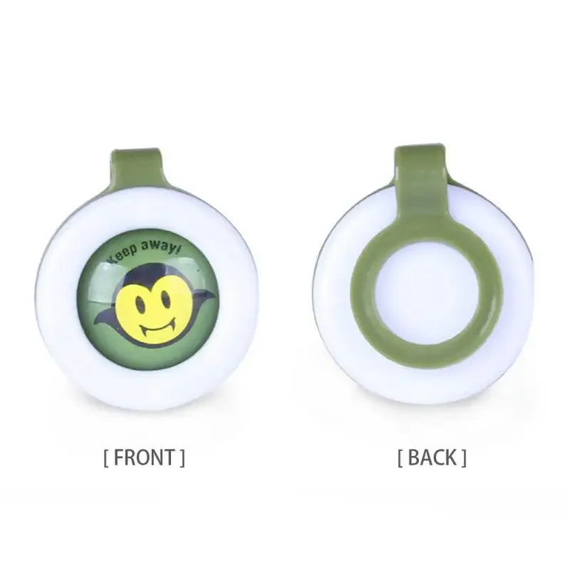 White and green natural mosquito repellent clip with a cartoon vampire face and "Keep away!" text.