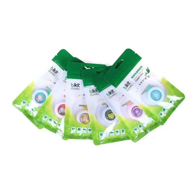 Five "Bikit Guard" natural mosquito repellent clips in various colors, packaged in clear and green plastic.