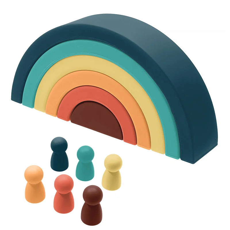 Soft silicone rainbow stacking toy with colorful arches and six peg people figures.