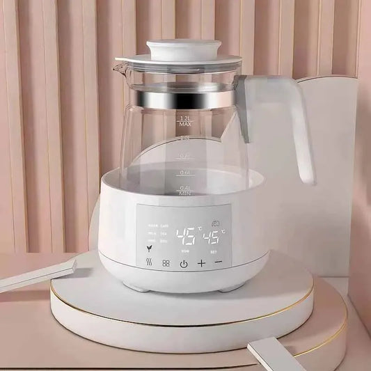 White smart kettle with a clear 1.2L borosilicate glass body, digital display, and temperature control.