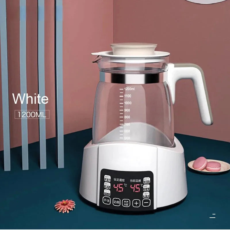 White 1.2L smart thermostat kettle for baby milk, with clear glass pitcher, digital display, and white base.