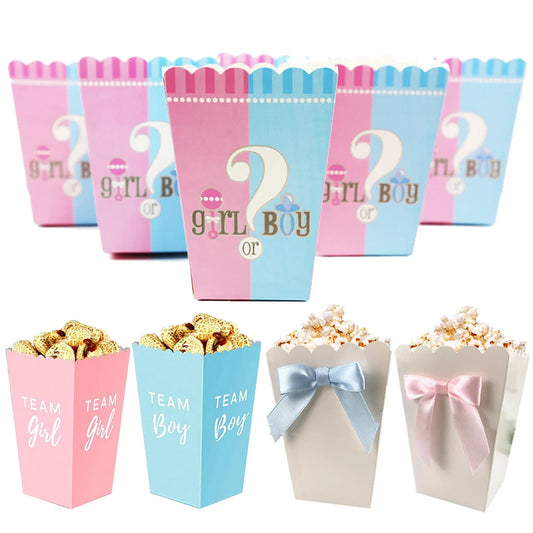 Pink and blue gender reveal popcorn boxes with "Girl or Boy" and "Team Girl/Boy" designs, some with bows.