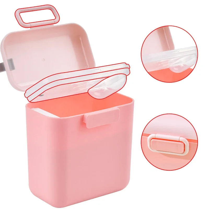 Pink portable baby formula storage box with lid, separate spoon compartment, and handle.