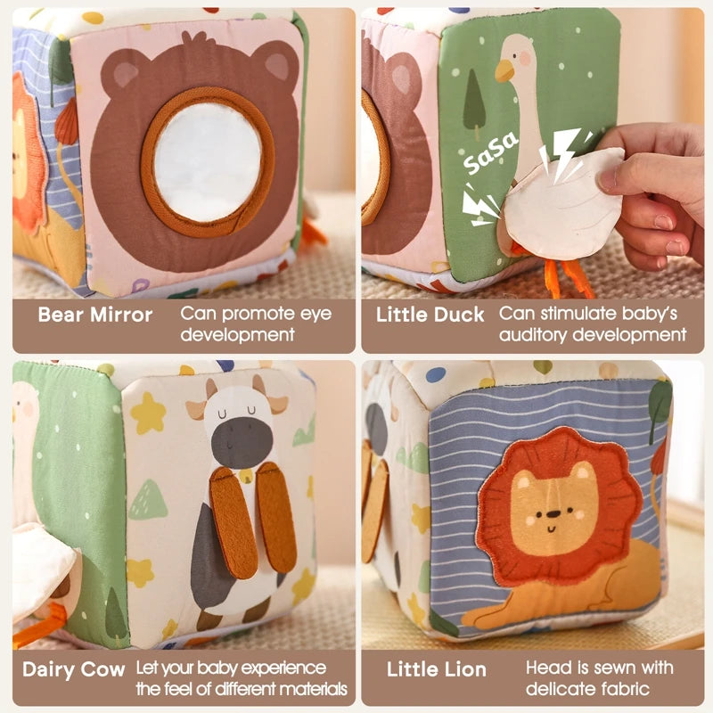Soft fabric baby activity cube with animal designs, mirror, crinkly duck, and textured cow.