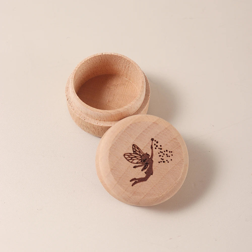Natural beech wood keepsake box with a fairy design on the lid, open to show the interior.