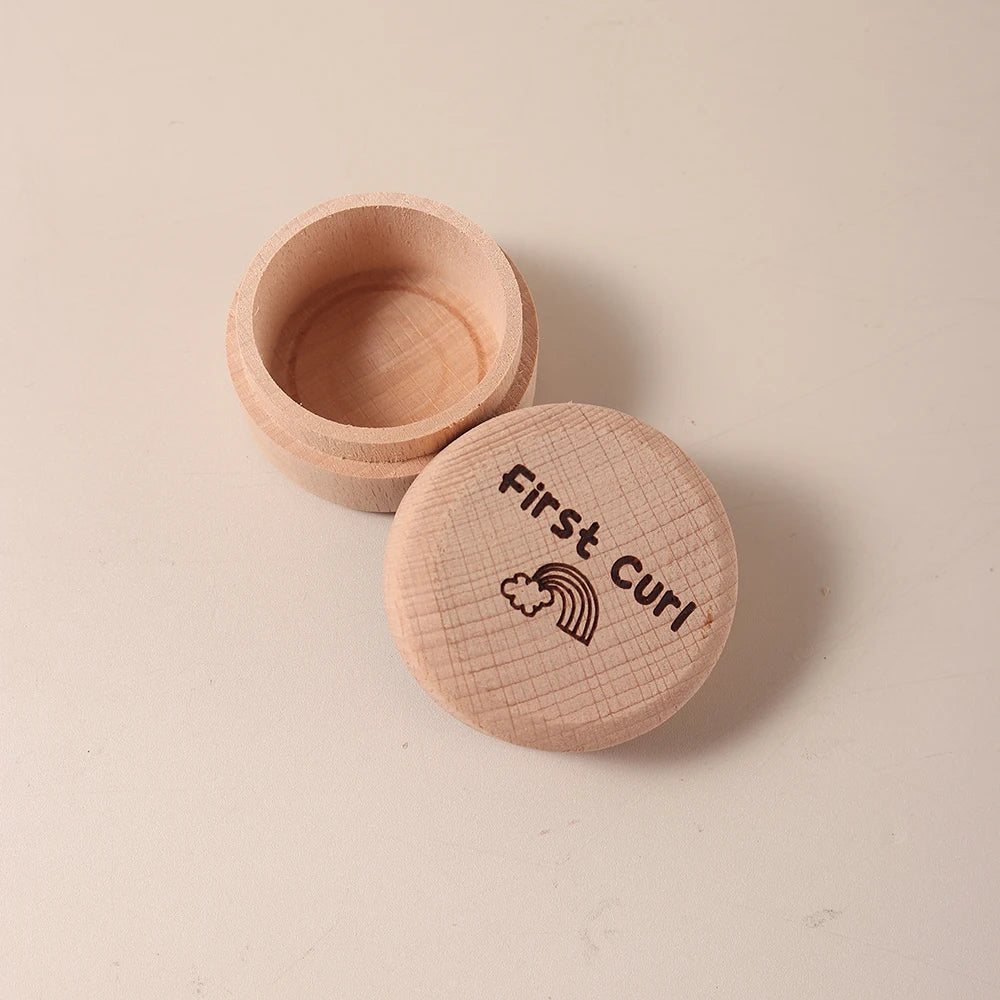 Natural beech wood keepsake box for baby's first curl, with a rainbow design on the lid.