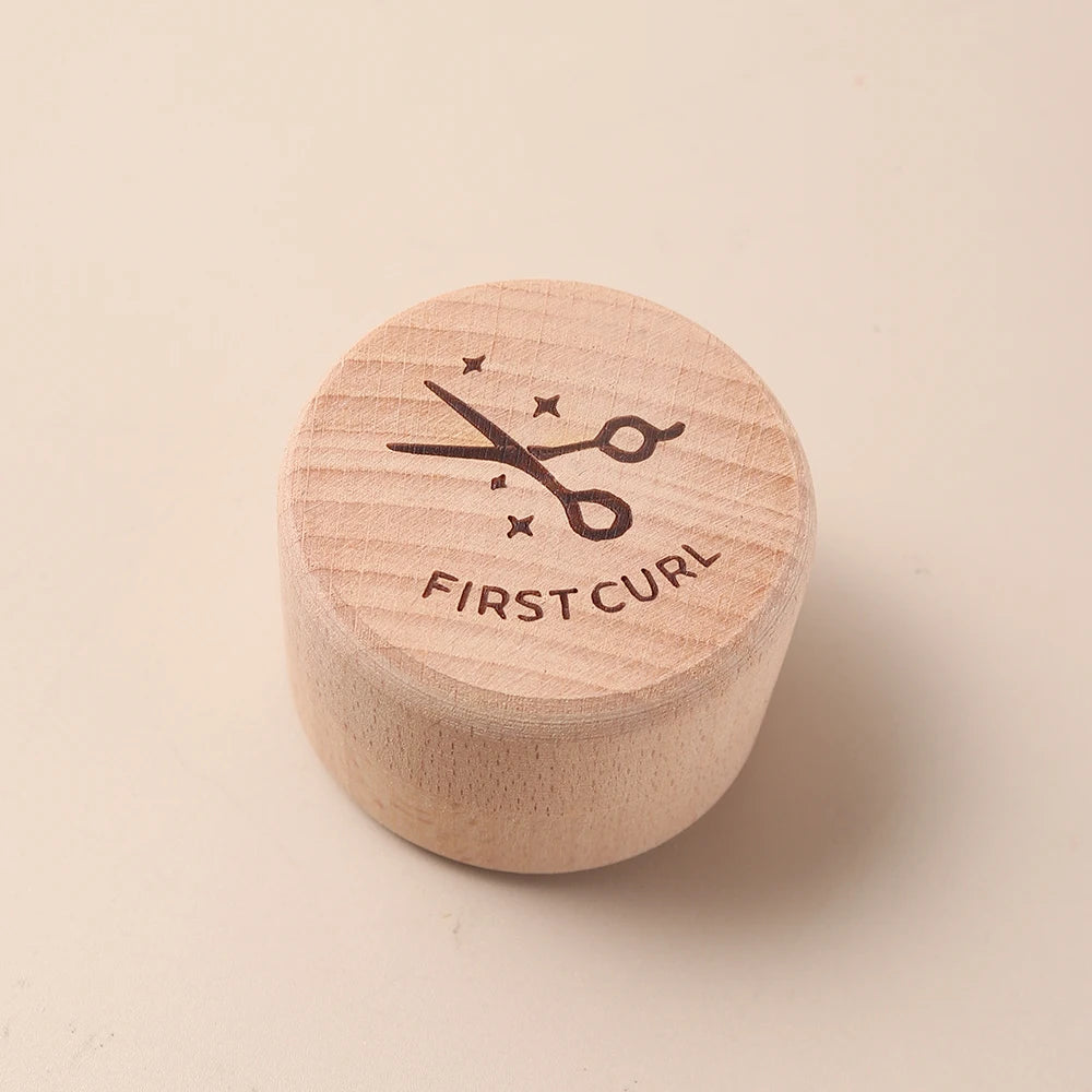 Natural beech wood keepsake box for baby's first curl, with scissors icon and "FIRST CURL" text.