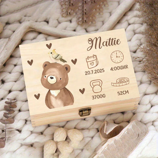 Personalized wooden baby memory box with laser-engraved bear, bird, name "Mattie," birth date, time, weight, and length.