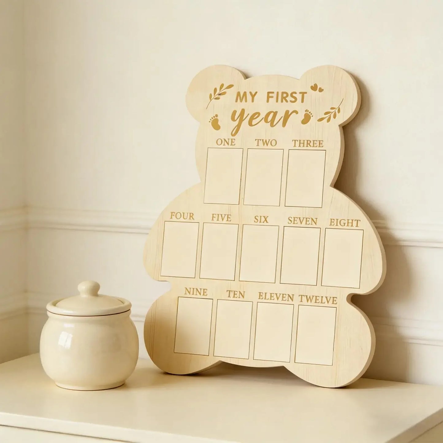 Wooden bear-shaped baby milestone board for "My First Year," with 12 monthly photo slots.