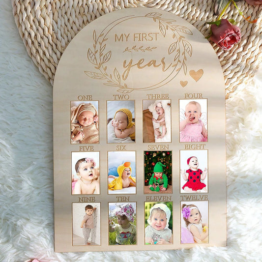 Wooden baby milestone board with "My First Year" engraving and 12 photo slots.