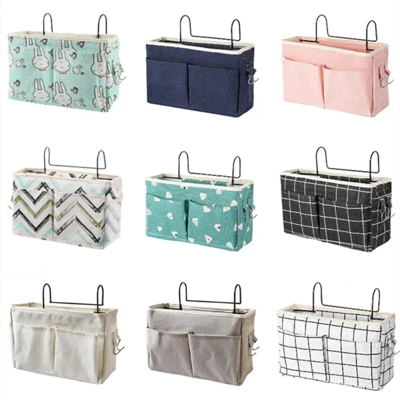 Assorted multi-pocket cotton bed organizers with metal hooks in various colors and patterns.