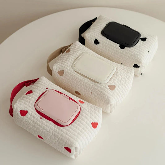 Quilted cotton hanging tissue and wipe dispensers in white with red hearts, brown bears, and black spots.