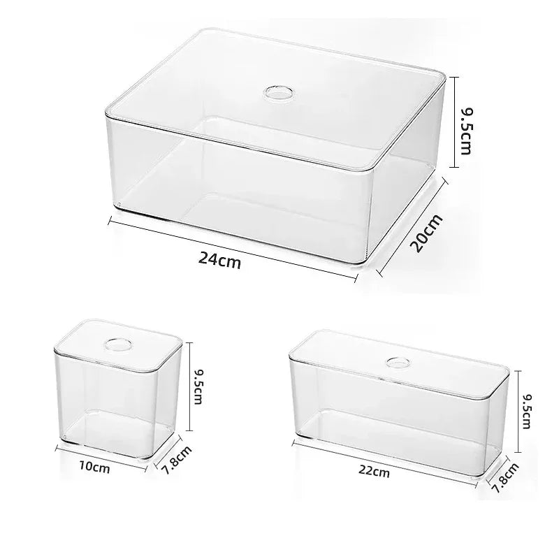 Set of clear acrylic storage boxes with lids, showing various sizes for drawer organization.