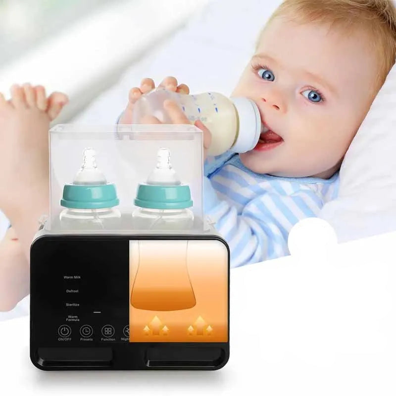 Black digital baby bottle warmer and sterilizer with two bottles, next to a baby feeding.
