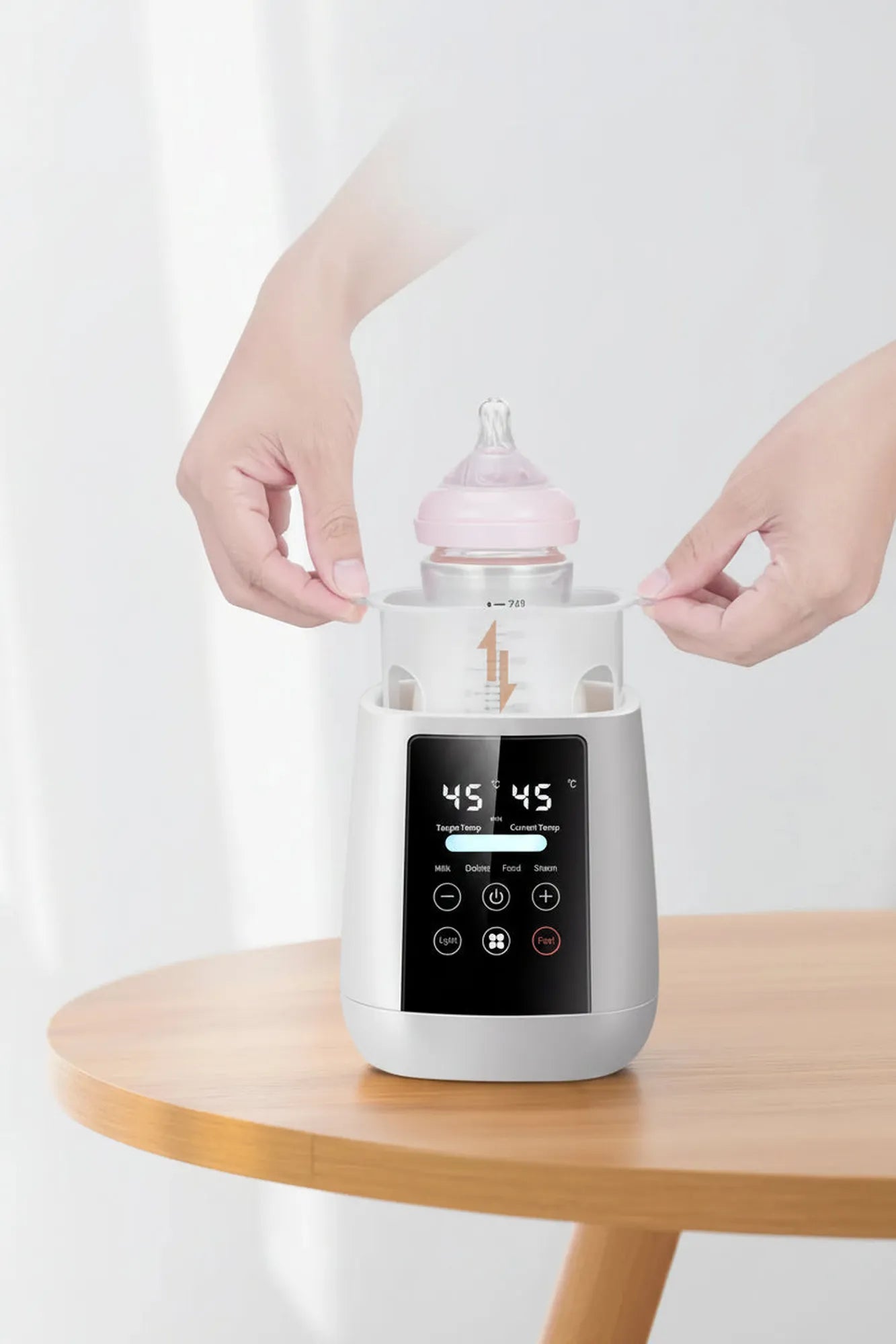 White digital 6-in-1 baby bottle warmer and sterilizer with LCD screen, holding a pink bottle.