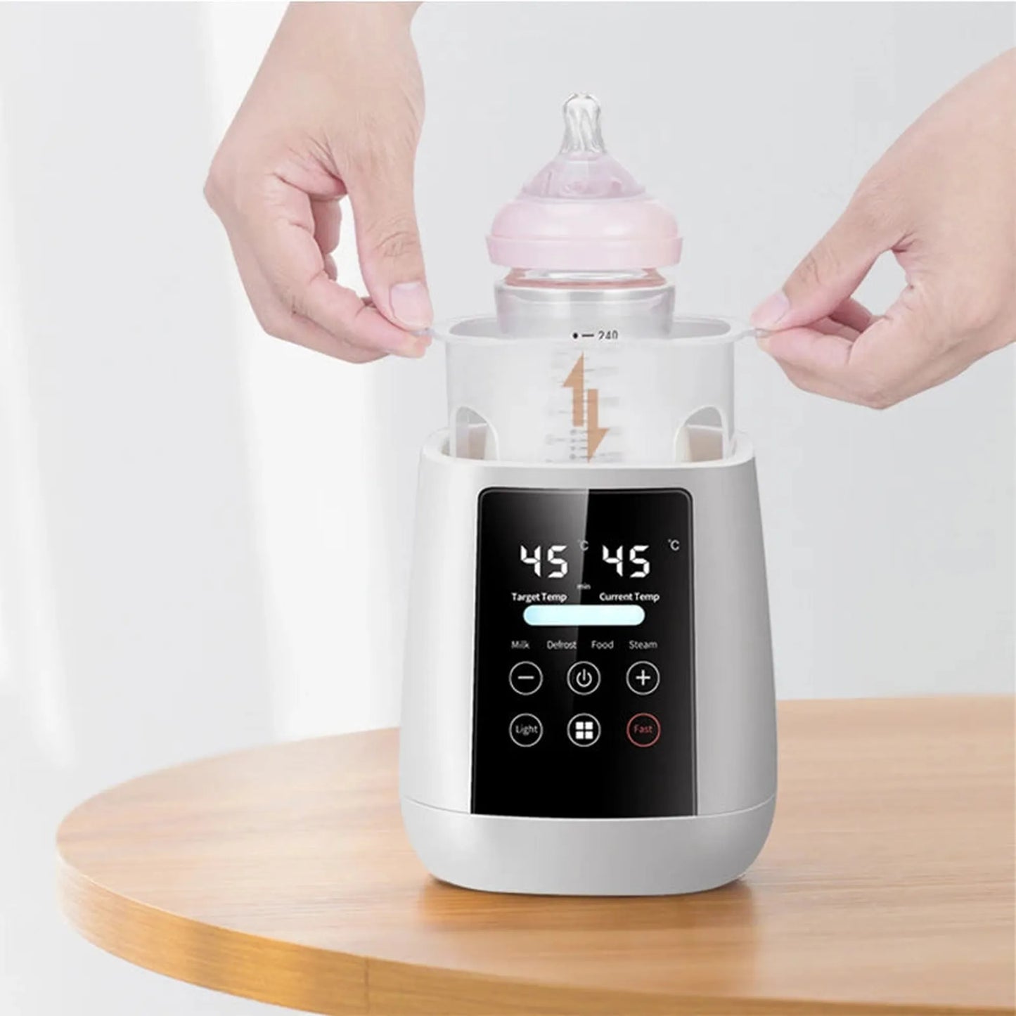 White digital 6-in-1 baby bottle warmer and sterilizer with LCD screen, holding a pink bottle.