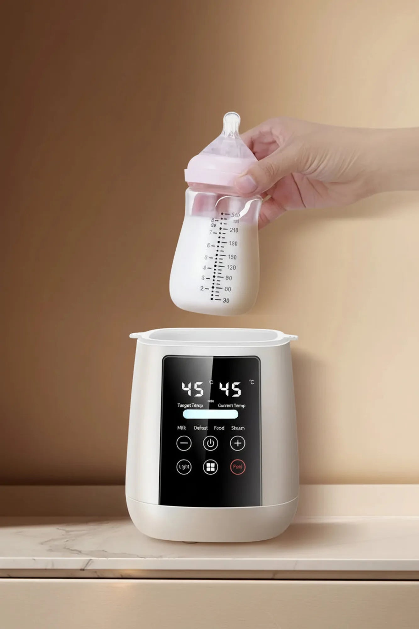 Digital 6-in-1 baby bottle warmer and sterilizer in cream, with a hand holding a pink bottle.