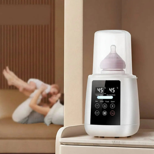 White digital 6-in-1 bottle warmer and sterilizer with LCD screen, a baby bottle inside, on a light brown surface.