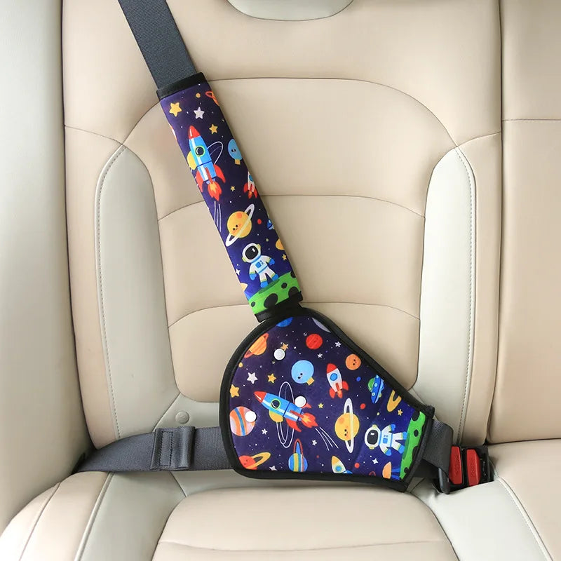 Kids' car seat belt adjuster with a colorful space-themed pattern, featuring rockets and planets.