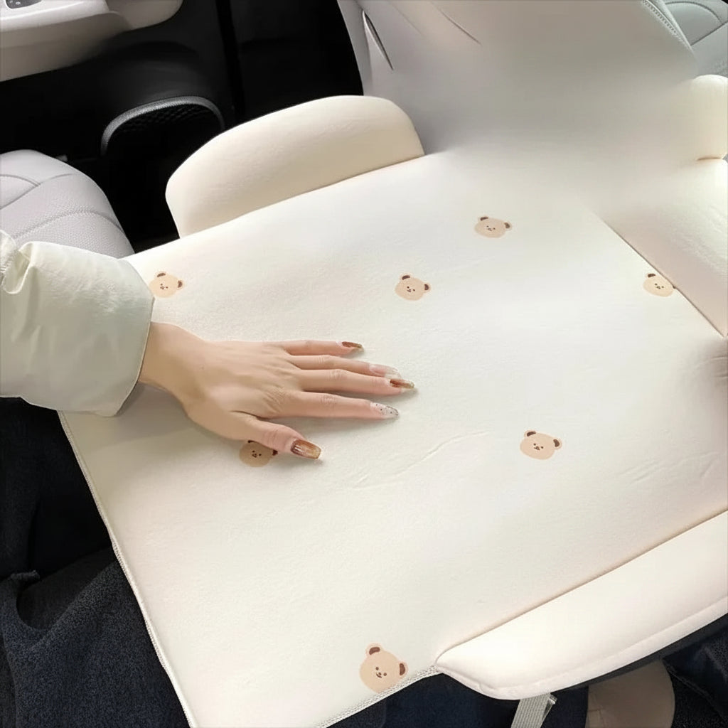 Beige car changing pad with cute bear print, high resilience sponge, and soft support.