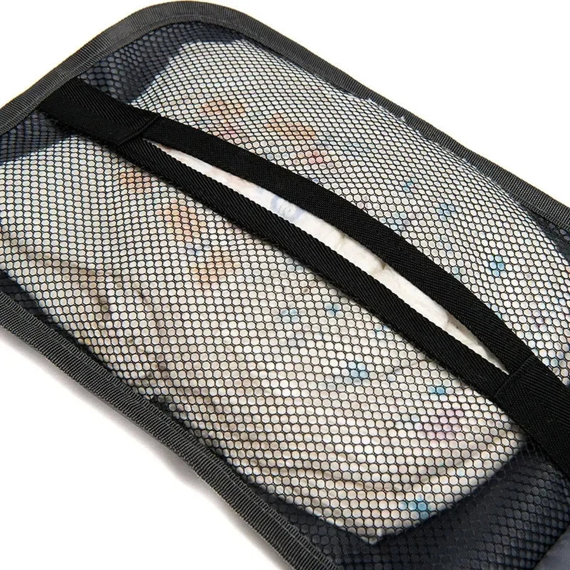 Portable baby changing pad with mesh pockets holding diapers and wipes.