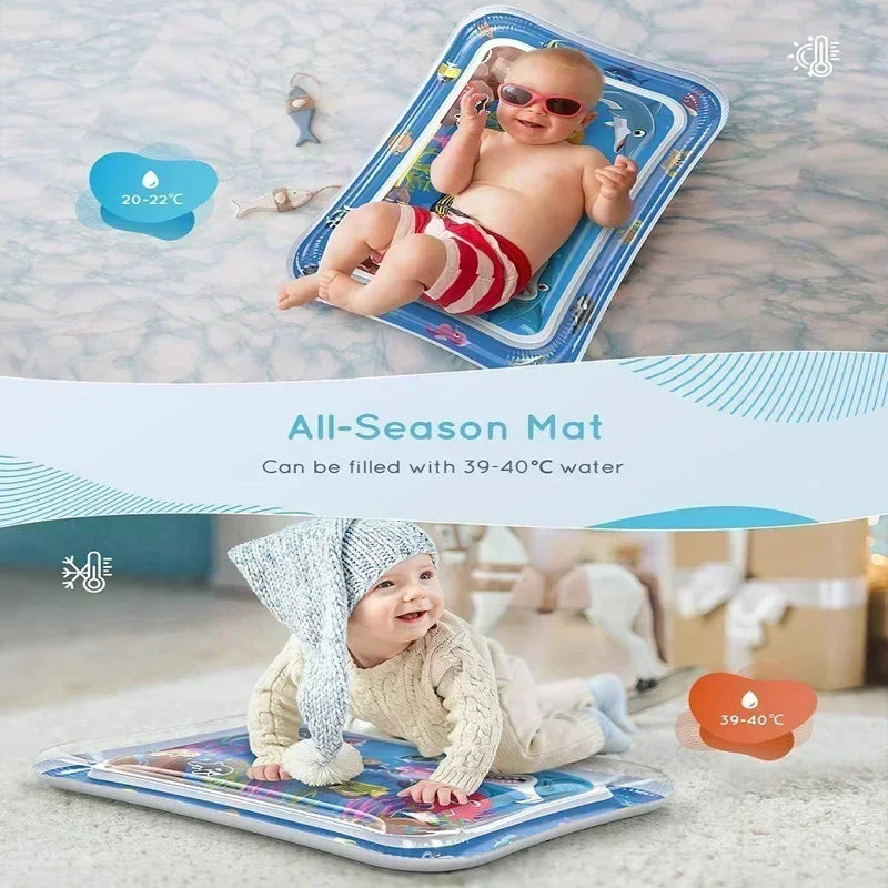 Happy babies on a blue inflatable water play mat with floating sea creatures, promoting motor development.