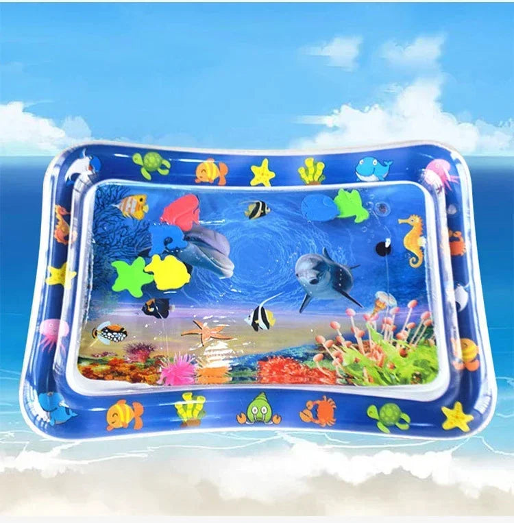 Inflatable blue water play mat for babies with colorful floating sea creatures for sensory and motor development.