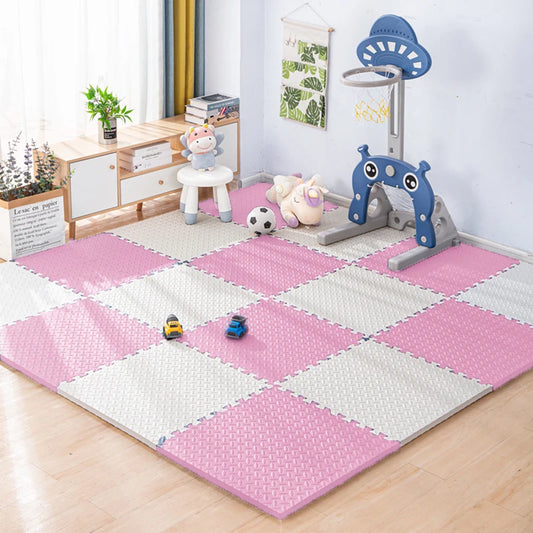Pink and white foam puzzle play mat for babies, 1cm thick, in a child's room with toys.