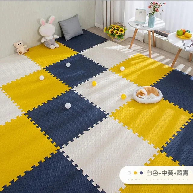 Interlocking EVA foam puzzle play mat in white, yellow, and navy blue, with textured squares.