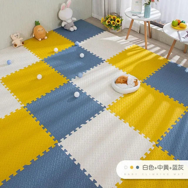 Interlocking foam play mat for babies, featuring 16 puzzle pieces in white, yellow, and blue.