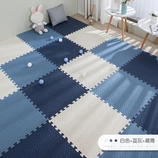 Blue and white interlocking EVA foam puzzle play mat for babies, featuring a textured surface.