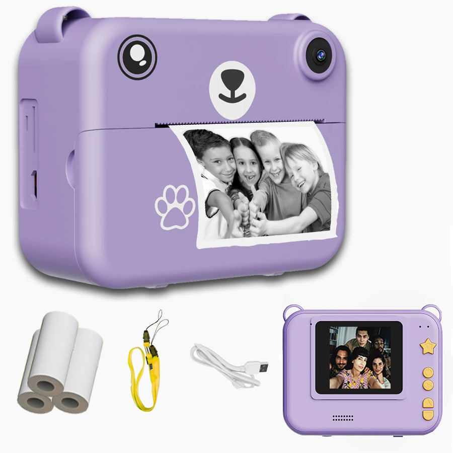 Purple bear-shaped instant print camera for kids, showing a black and white photo, with accessories.