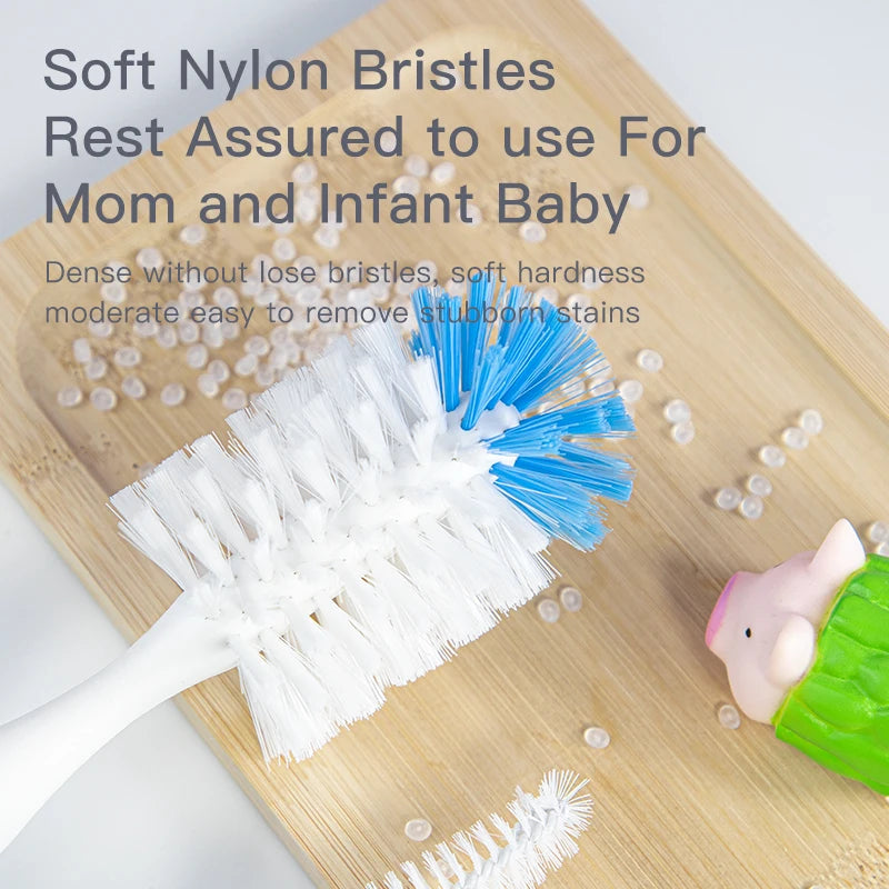 White and blue nylon bottle brush with soft bristles on a wooden surface.