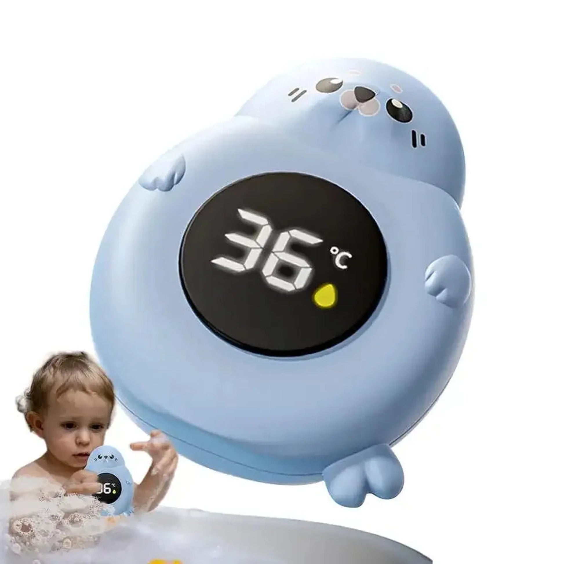 Blue seal-shaped digital bath thermometer displaying 36°C, with a baby playing in a tub.