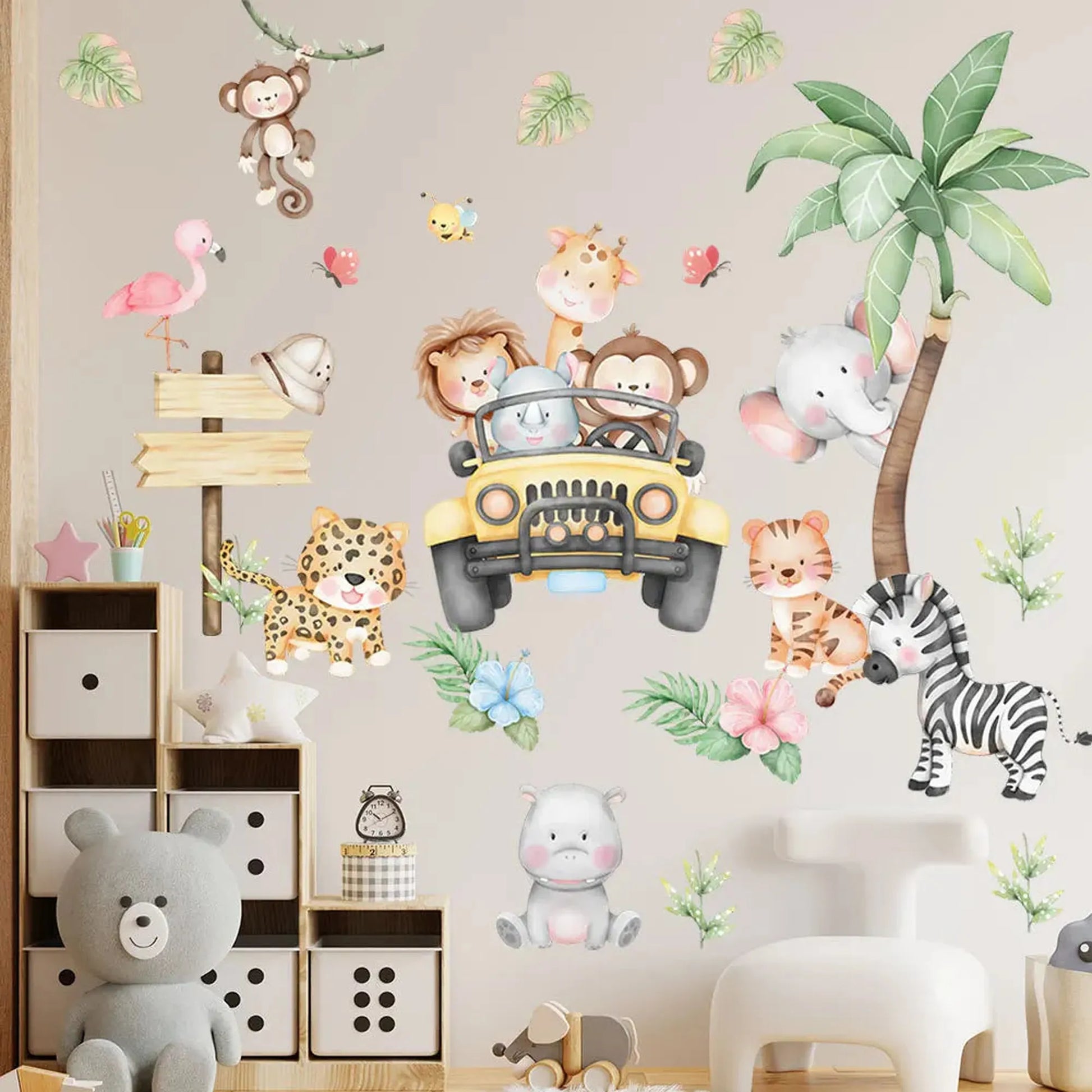 Colorful PVC jungle animal wall decals for nursery, featuring a safari jeep, elephant, lion, monkey, giraffe, flamingo, zebra, and leopard.