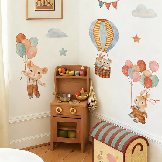 Cartoon animal wall decals for kids' room: a mouse with balloons, bunnies in a hot air balloon, and a bunny on a swing.