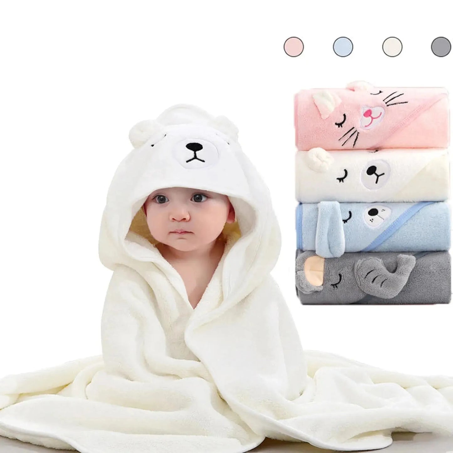 Baby in a soft white coral fleece hooded towel with a bear face, next to stacked animal-design towels in pink, white, blue, and gray.
