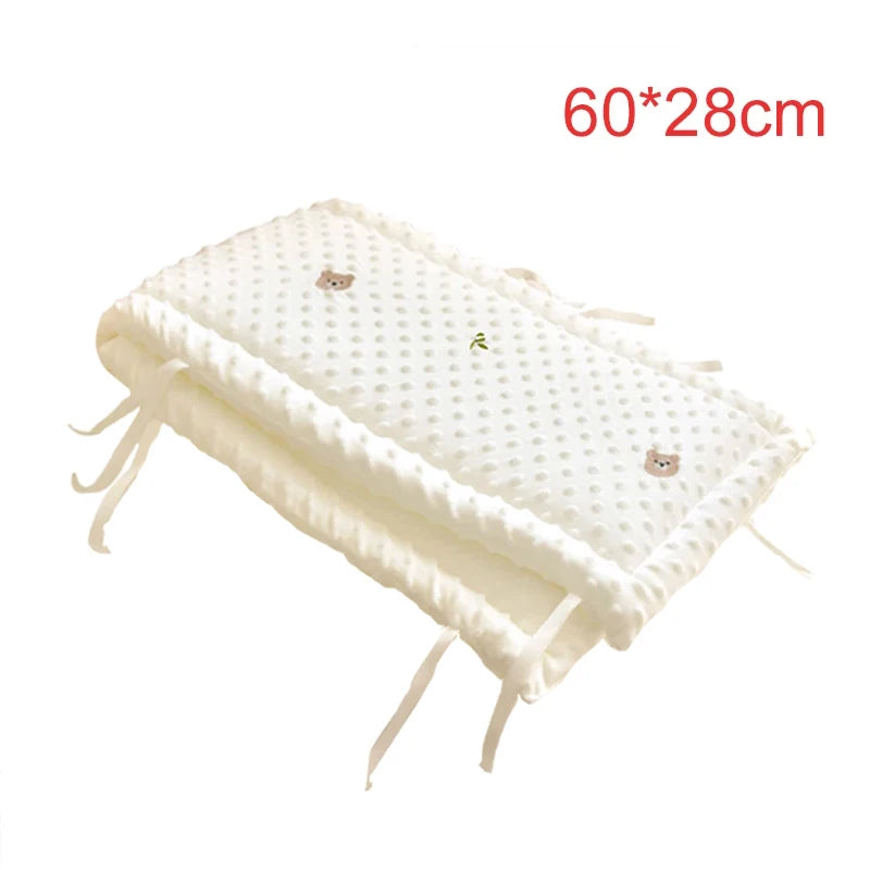 Soft white polyester crib bumper with cute bear embroidery and ties, 60x28cm.