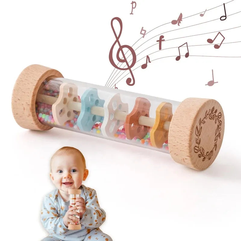 Montessori rainbow rain stick rattle with wooden ends, colorful beads, and a baby holding it.