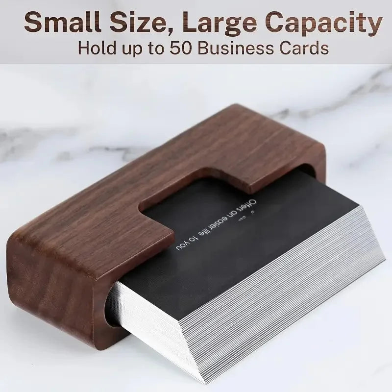 Dark brown natural wood business card holder with a minimalist design, holding a stack of black cards.